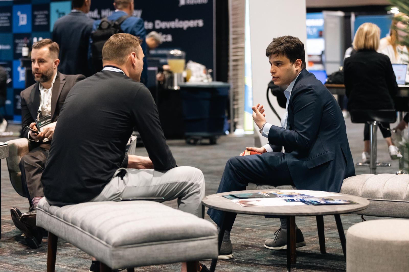 RETCON attendees discussing business opportunities at the conference